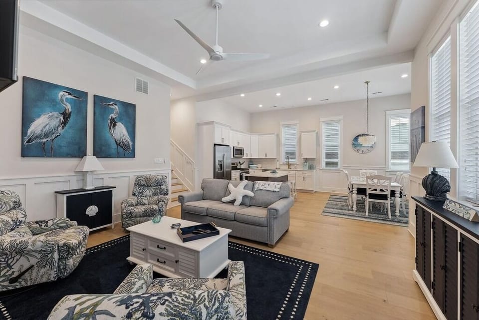 Open Living, Dining & Kitchen Area with Coastal Accents & Natural Light