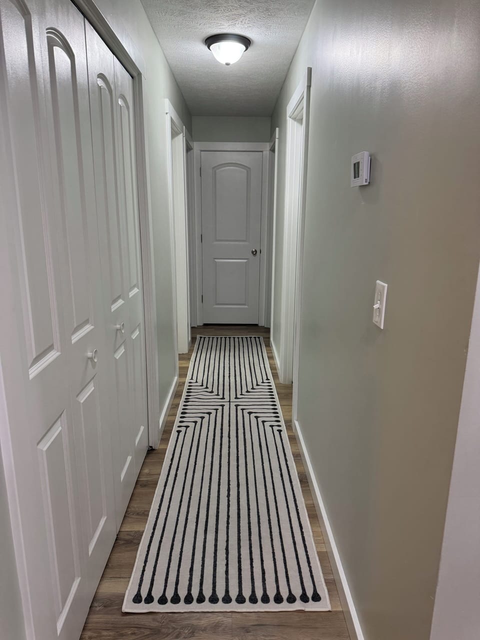 Hallway to Washer and dryer/Bedrooms