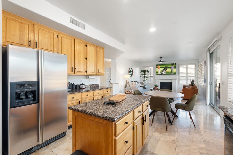 Kitchen overlooking breakfast area and family room