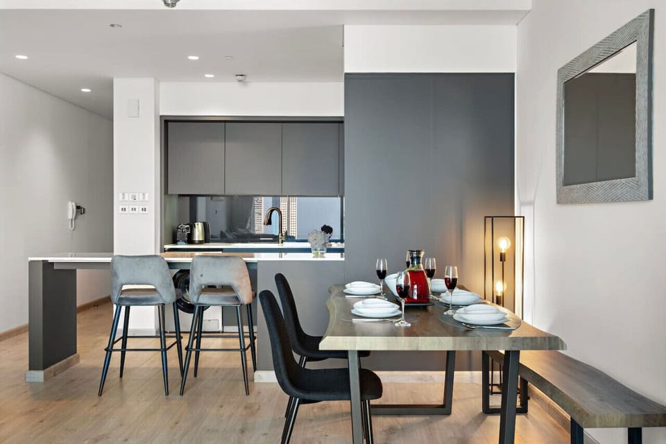 Dining Room: Chic design meets modern comfort with stunning skyline views for memorable meals!