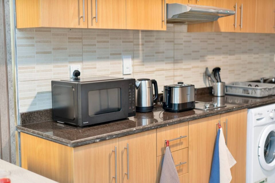 Modern Kitchen: Enjoy culinary adventures with sleek appliances and stylish finishes!