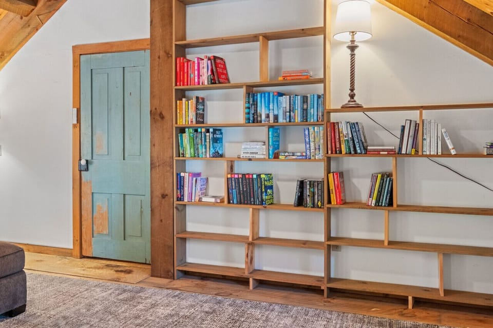 Step inside to our cozy entryway and library.