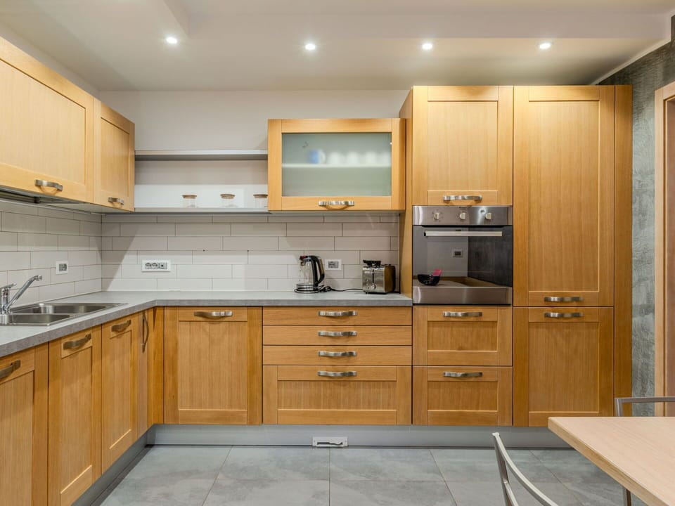 Cabinetry, Kitchen, Furniture, Countertop, Flooring, Wood, Kitchen Appliance, Major Appliance, Drawer, Cupboard