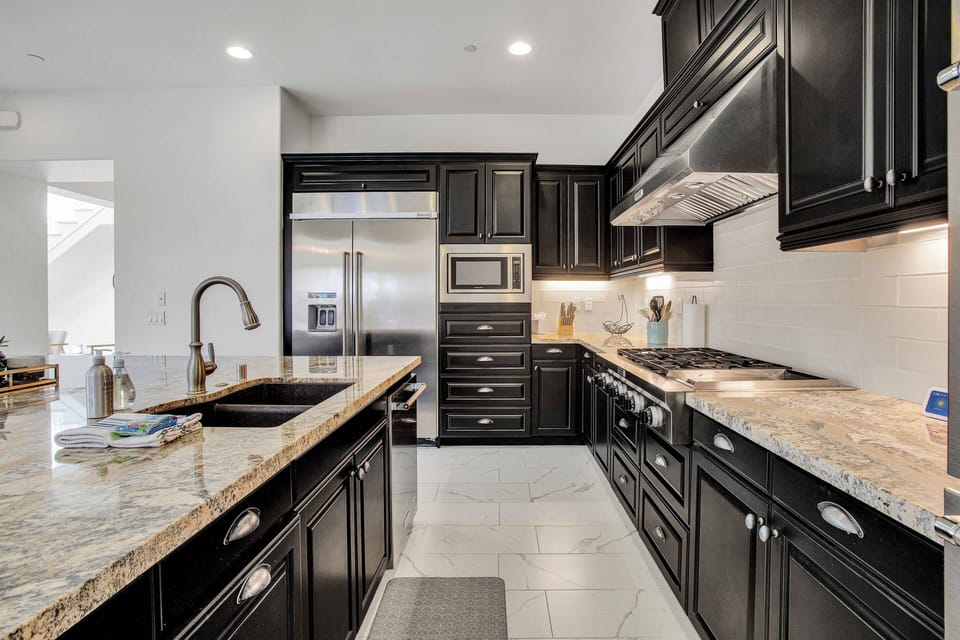 Fully equipped chef's kitchen with gas range and stainless appliances