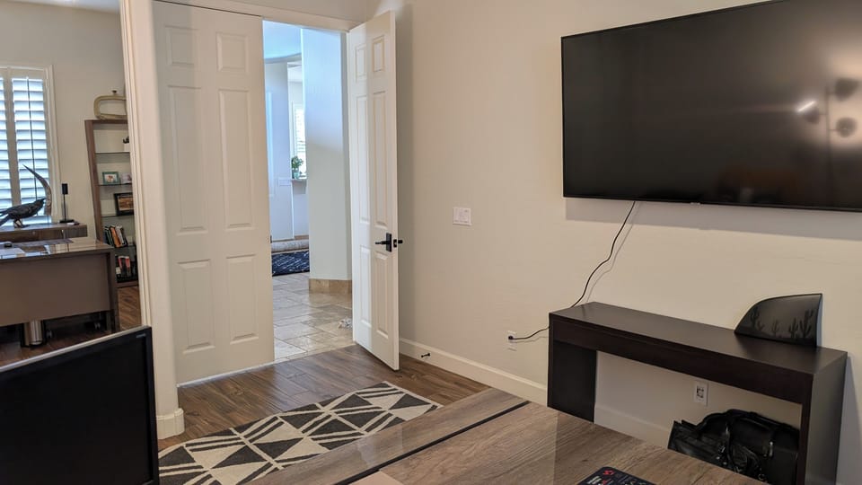 Office with TV for steaming services and printer