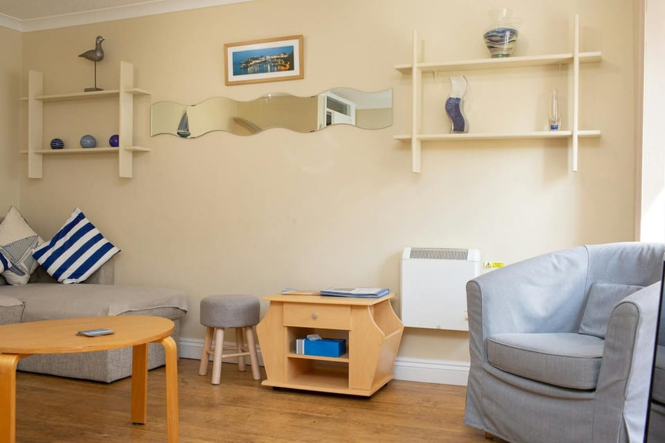 Armchair, coffee table and side table. Electric wall mounted heater