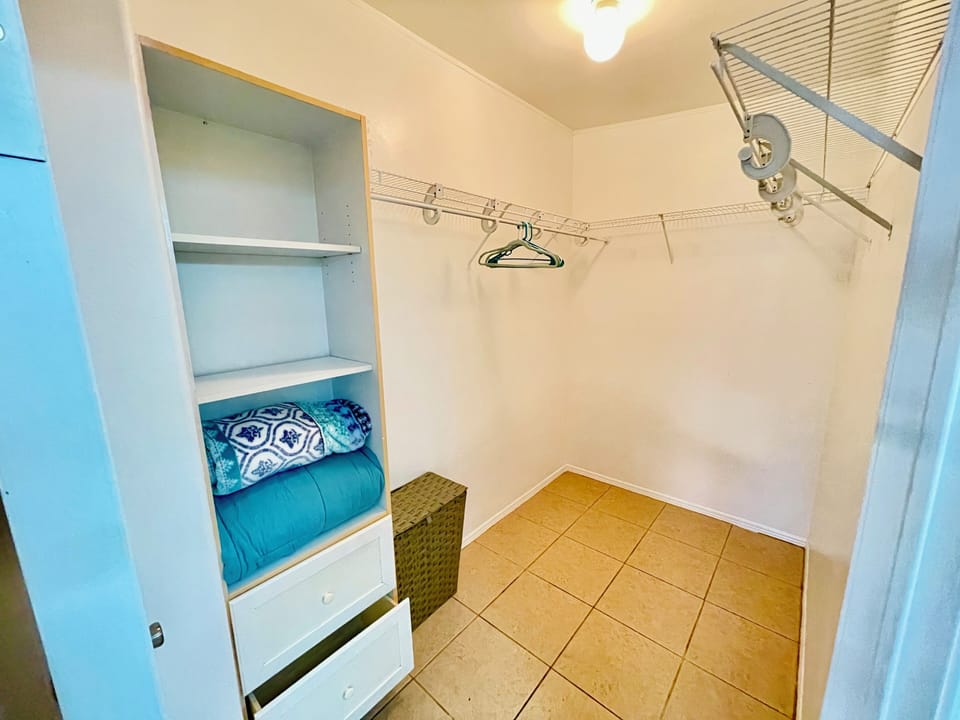 Master bedroom walk-in closet.  Large enough to put a portable crib or playpen.