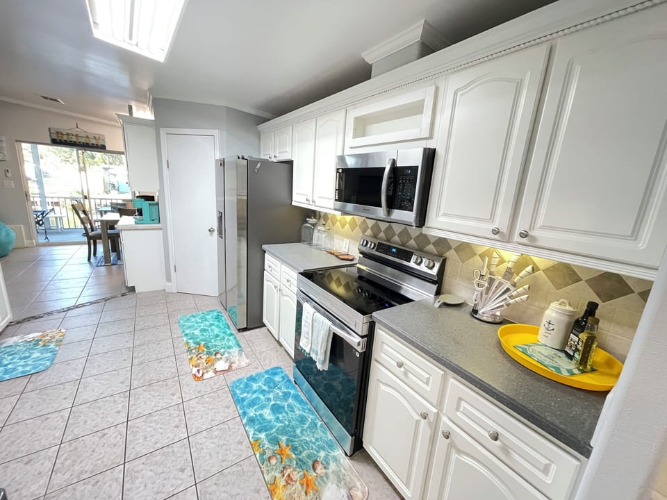 Check out our stocked kitchen with the water view so you don't miss a thing!