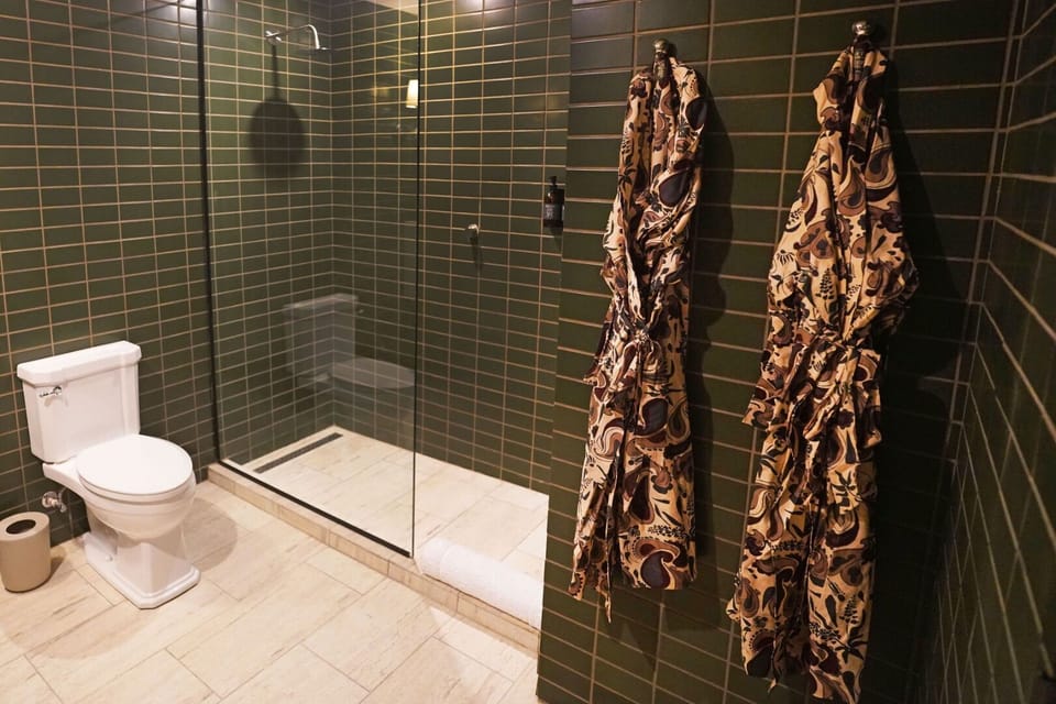 Enjoy an easy, open shower space with luxe tile finishes.