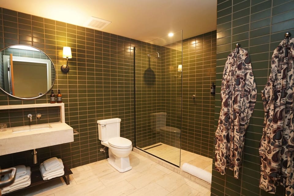 Refresh under the spacious glass shower with spa-style comforts.