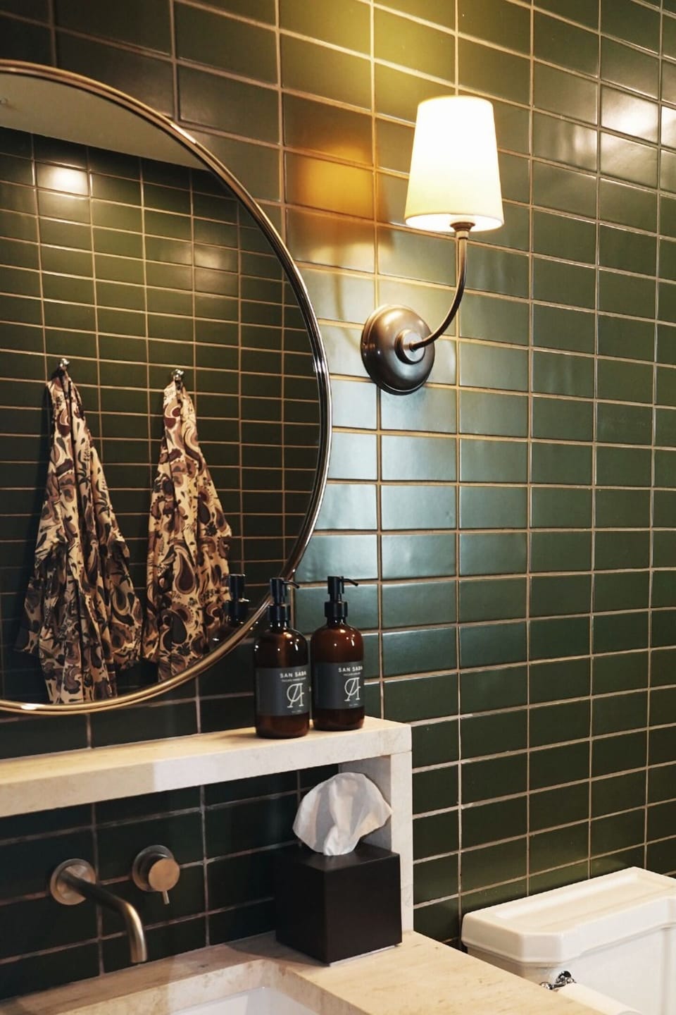 Enjoy evening ambiance with designer lighting and elegant vanity details.