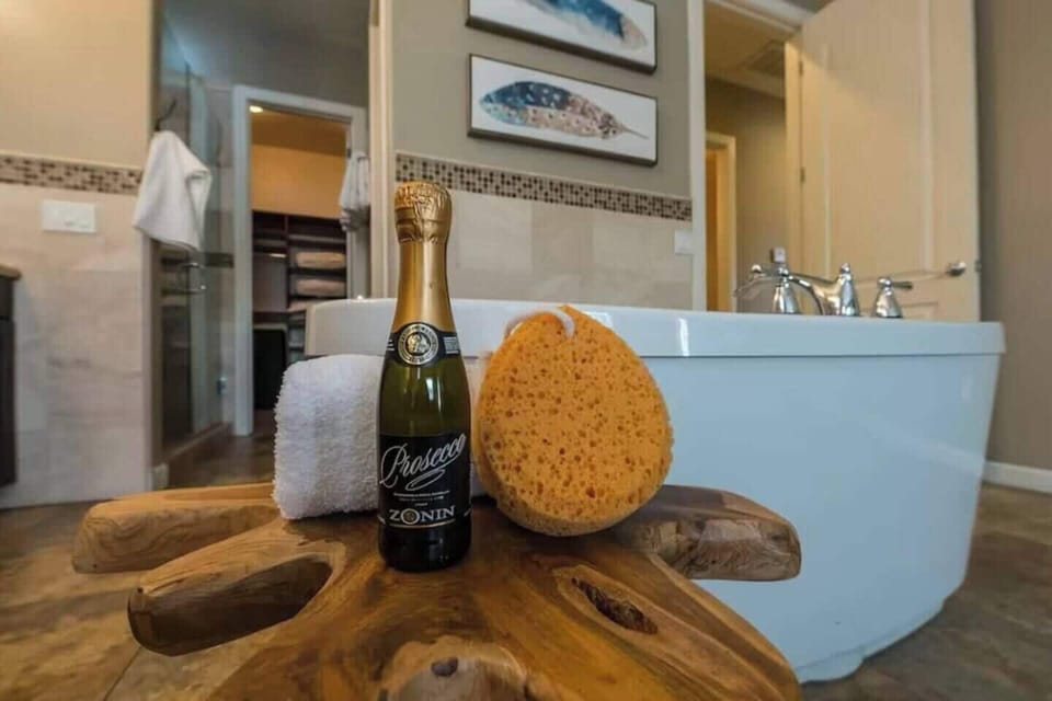 Relax in a sleek, freestanding tub perfect for a soothing soak in your private retreat.