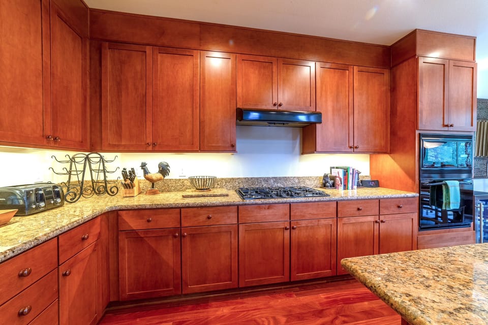 Kitchen has ample cabinet space and gas burning stove.