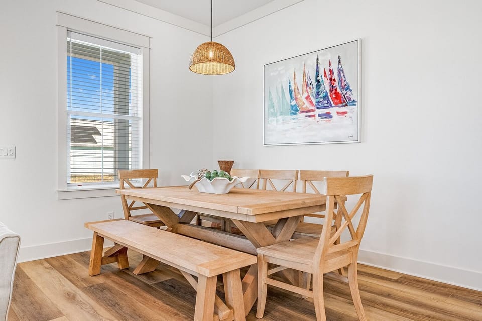 Dining Area ample space with a table and seating to accommodate family and guests.