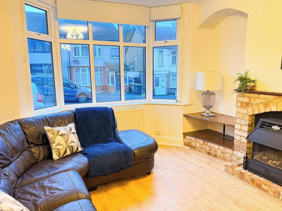 Large open living room with sofa and television.