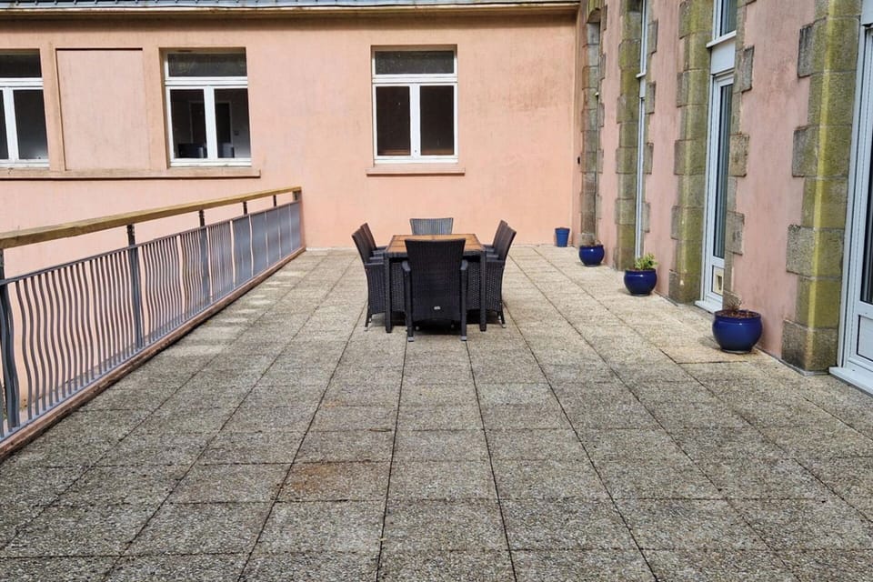 Private back terrace with dining table and BBQ, outside lights