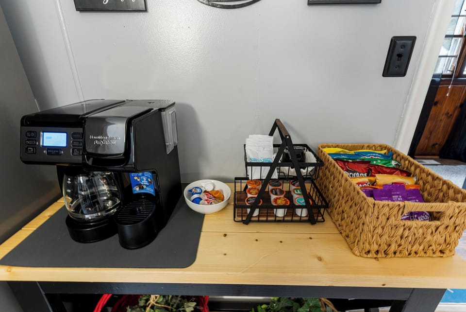 Full coffee bar complete with K-cups, creamer, hot chocolate & snacks! 