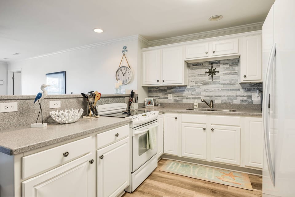 Kitchen comes complete with all appliances and spacious countertops for easy meal preparation.