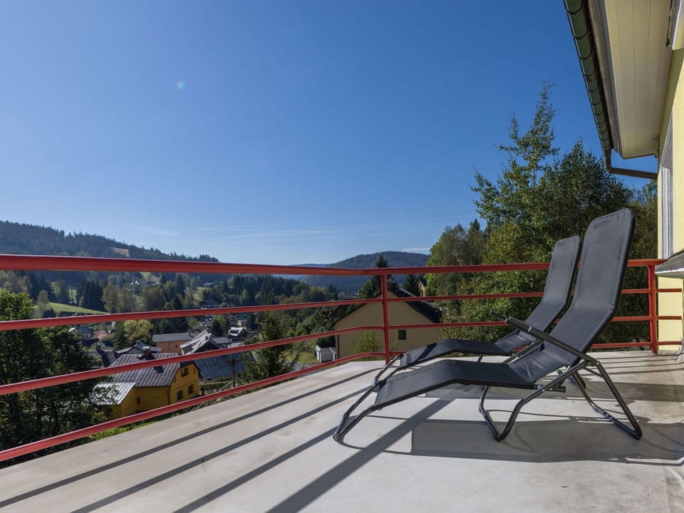 Sky, Chair, Outdoor Furniture, Leisure, Tree, Shade, Urban Design, Building, Landscape, Roof
