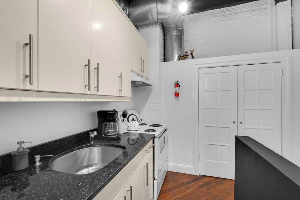 Contemporary kitchen with a cozy breakfast nook, perfect for enjoying your morning coffee.