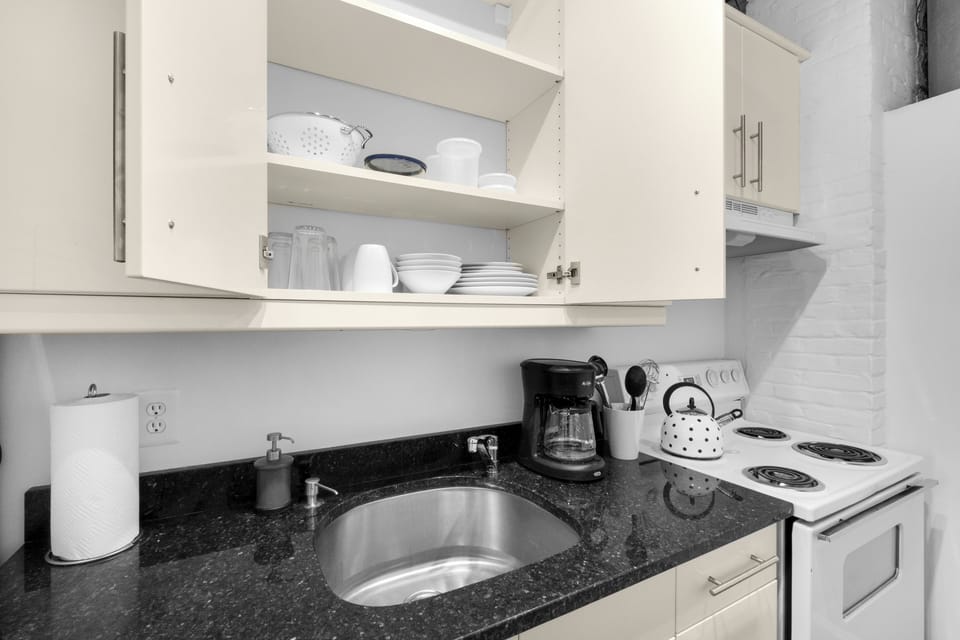 Fully equipped kitchen with modern appliances and ample counter space for all your cooking needs.