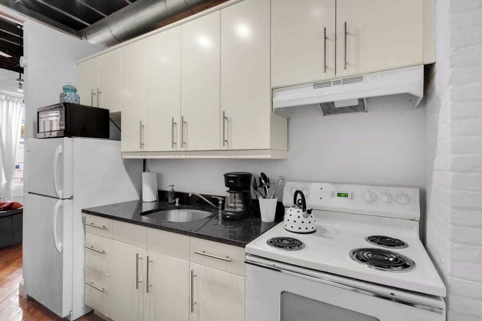 Fully equipped kitchen with modern appliances and ample counter space for all your cooking needs.