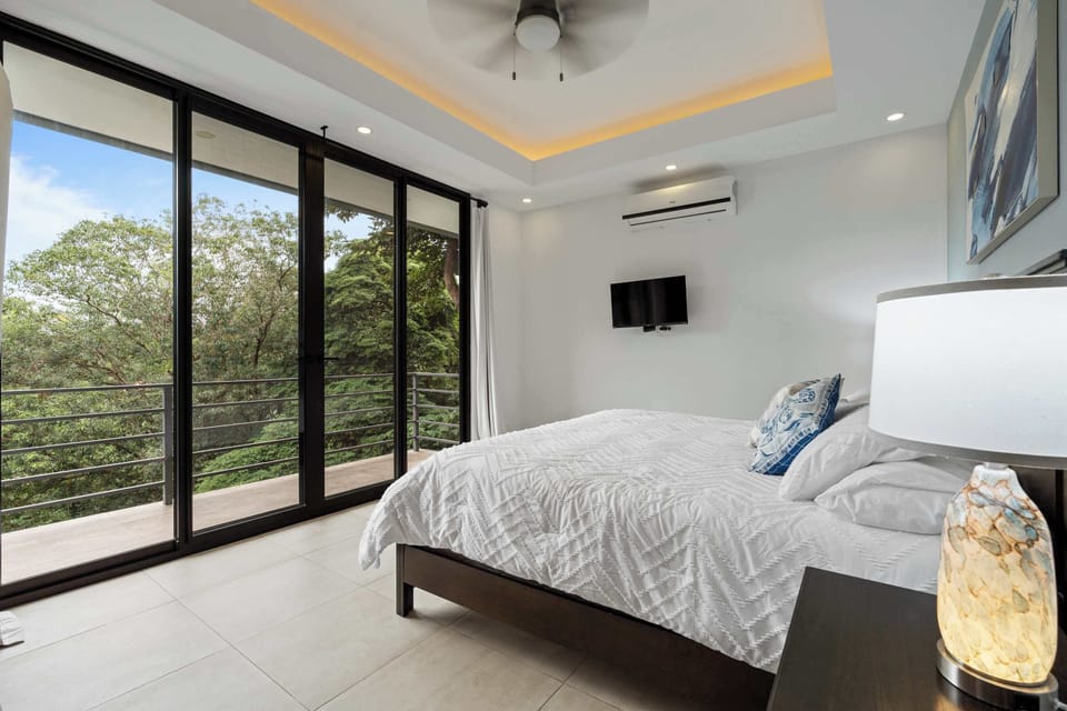 Wake up with nature: this bedroom is your sanctuary.