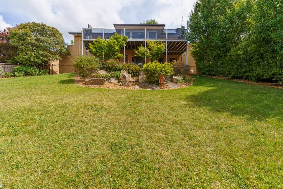 Spacious outdoor area with a large backyard for all your outdoor adventures.