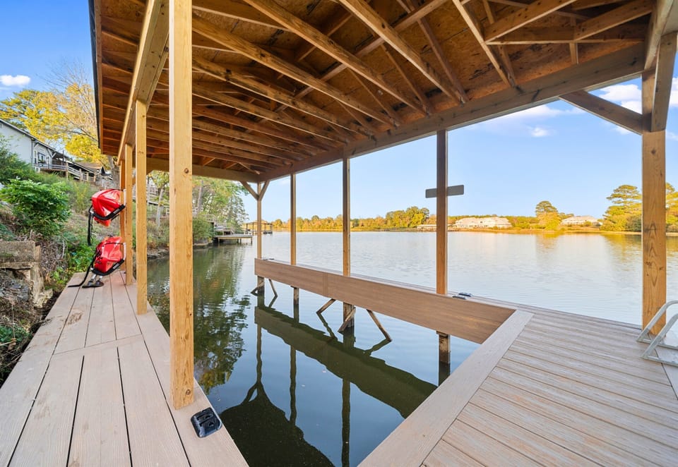 Large enough to accommodate a ski boat or barge, this dockside spot is perfect for quiet moments by the lake. Relax, enjoy the view, and let the calmness of the water wash over you.