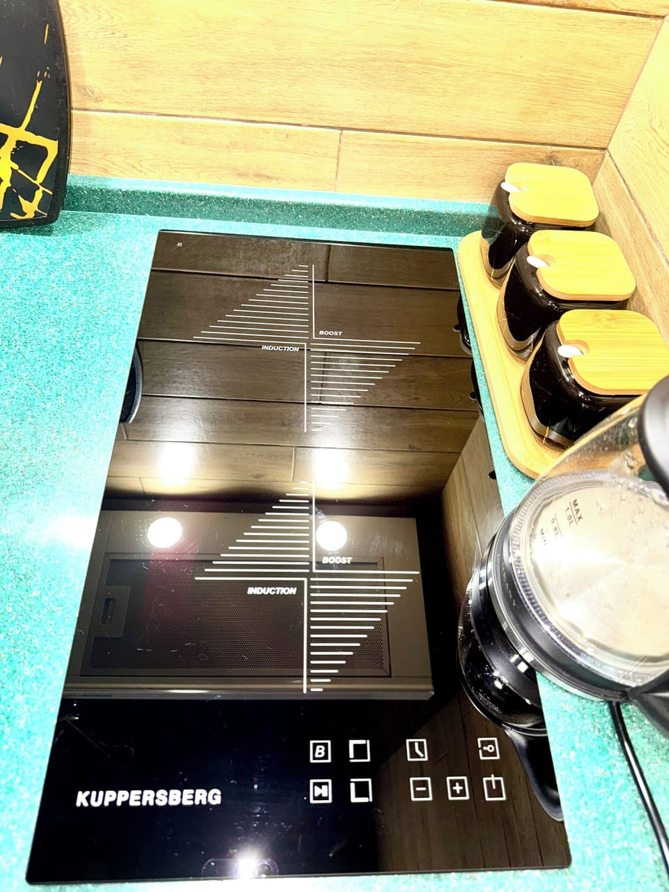 Kuppersberg induction cooktop & hood for clean, effortless cooking.