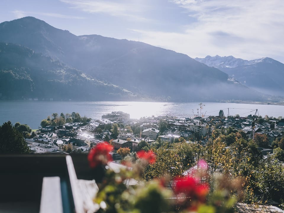 View from the balcony in Apartments Haus Altenberger by we rent. Lake view, city view, and mountain view.