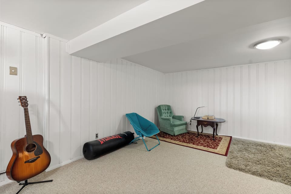 Open space with lounge chairs, and reading area.