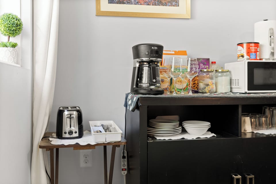 Complementary breakfast station with coffee, cereal, and more