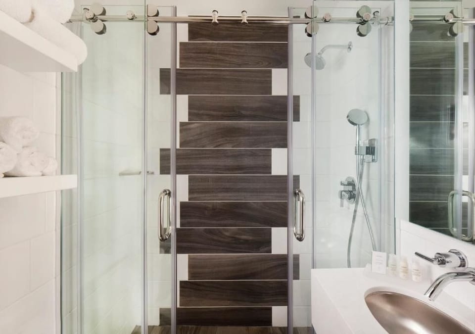 Refresh under a sleek glass shower with spa-like comfort.