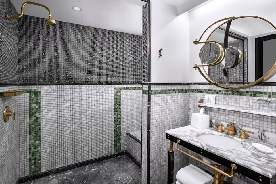 Refresh in a spa-like shower with gleaming brass details.