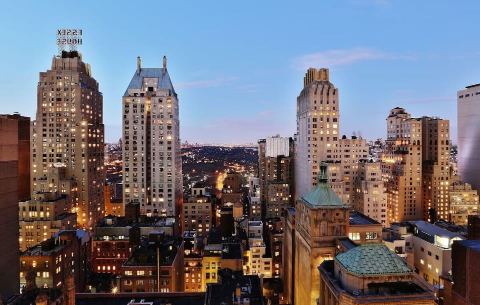 Wake up to sweeping treetop views stretching across the city.