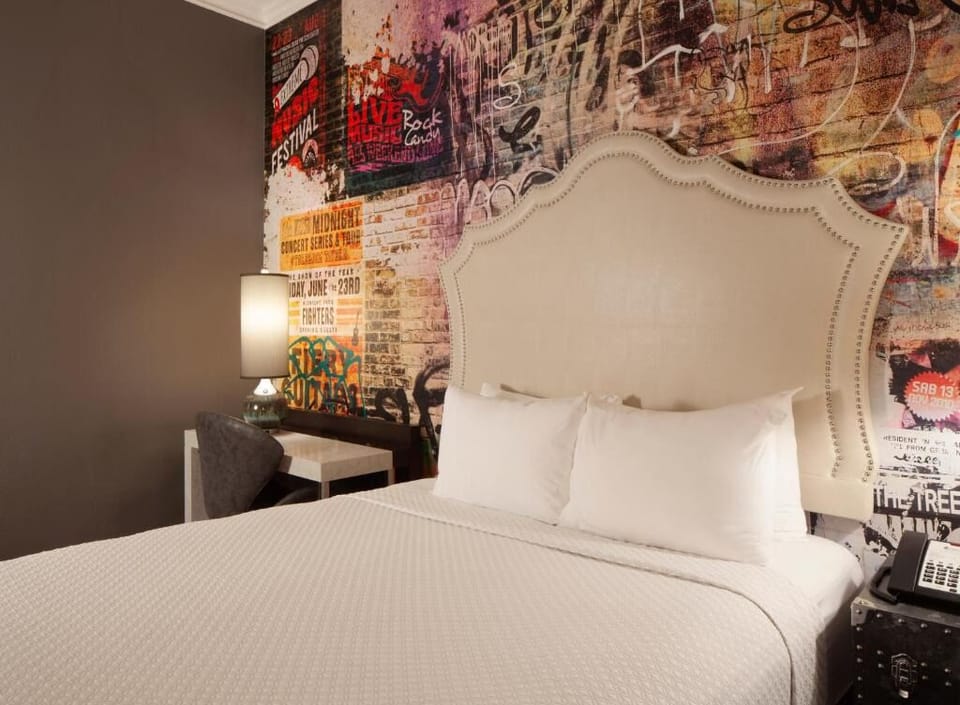 Sink into plush pillows beneath bold, artsy statement walls.