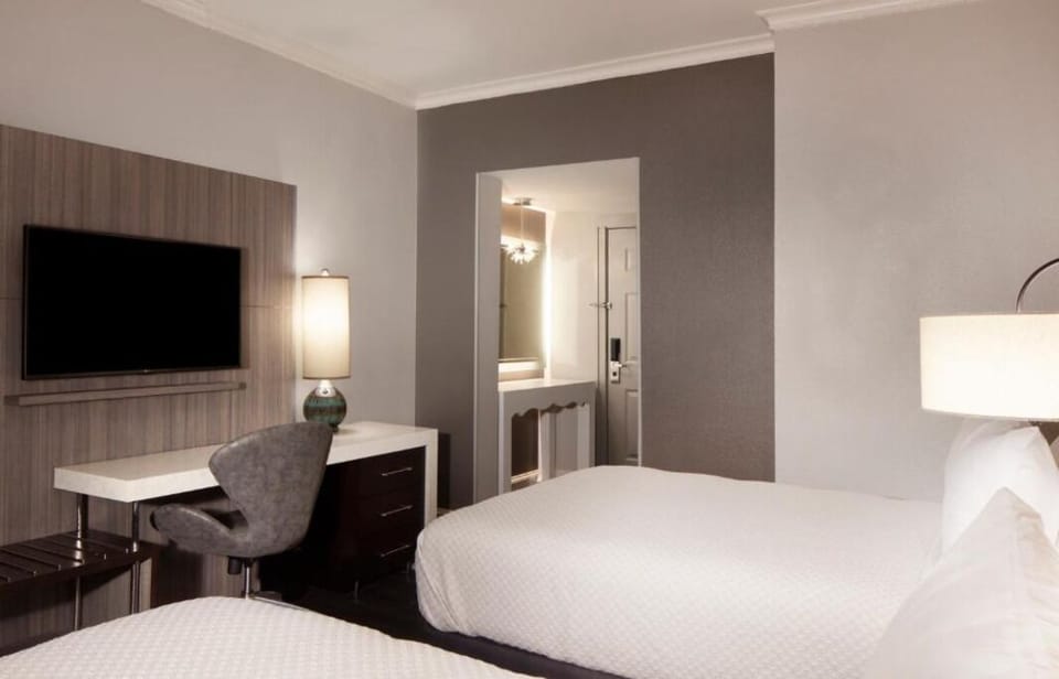 Unwind on crisp linens after a productive work session.