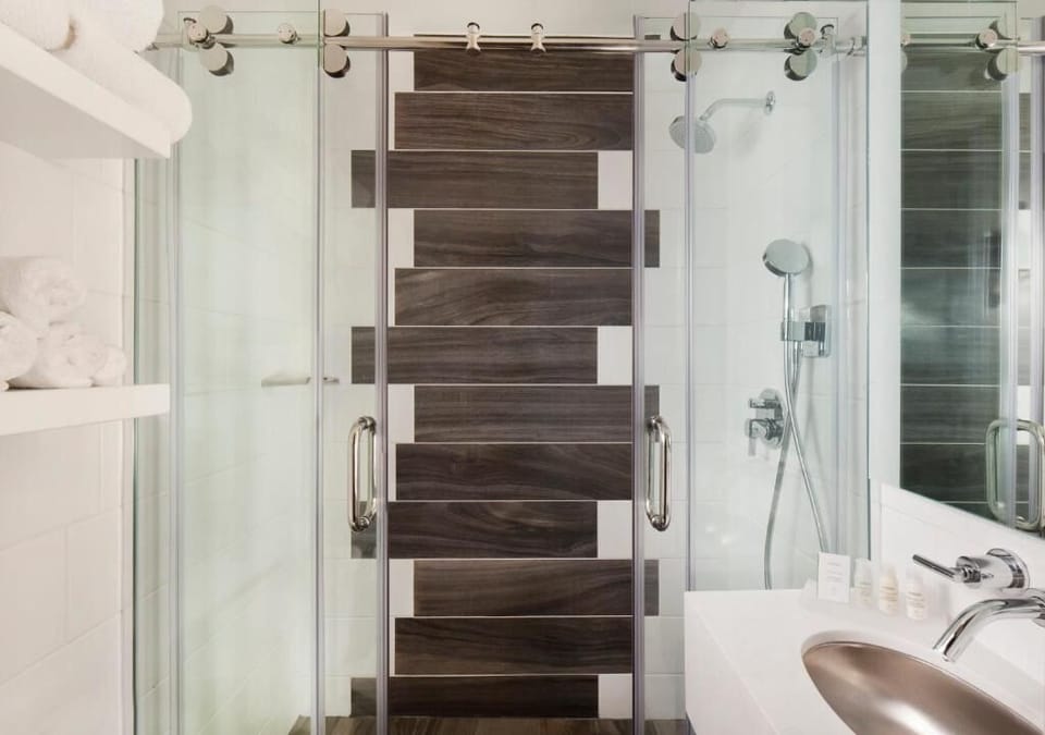 Refresh under a sleek glass shower with spa-like comfort.