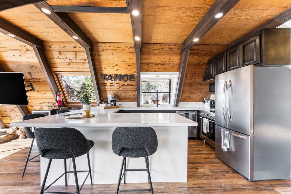A chef's delight! The gourmet kitchen features sleek countertops, state-of-the-art appliances, perfect for meal prep or casual dining. Seating for 4 around the kitchen. A drip coffee maker is provided.