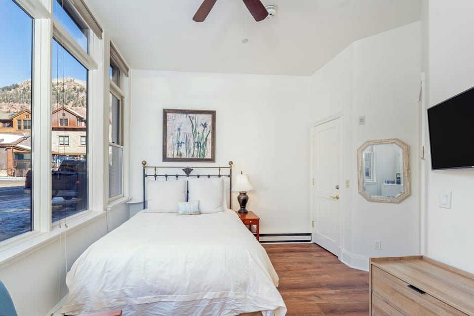The wall-mounted Smart TV pulls out for movies in bed.