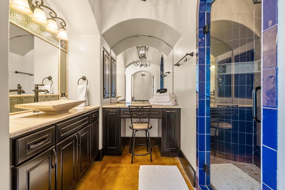 "Your private spa retreat awaits! 🛁✨ Soak in luxury in this beautifully designed master bath, featuring a serene soaking tub, dual vanities, and elegant Spanish-style details. The perfect pla