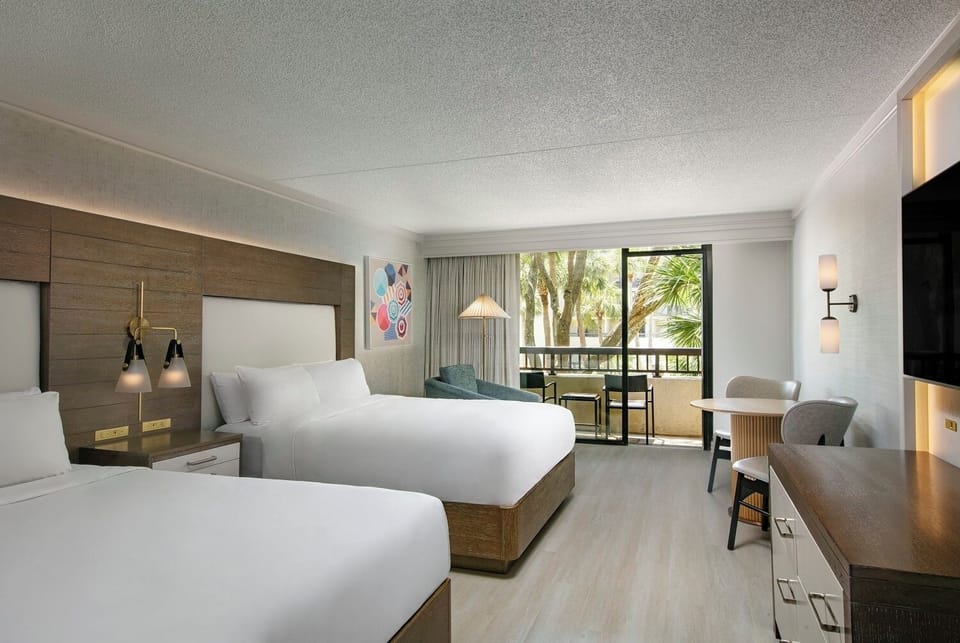Stretch out on crisp beds in a calm, airy retreat.