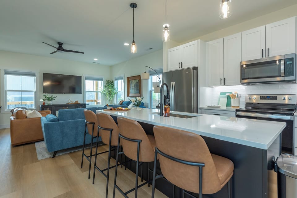 Bar View to Living Room with High Back Bar Stools & Seating for 4