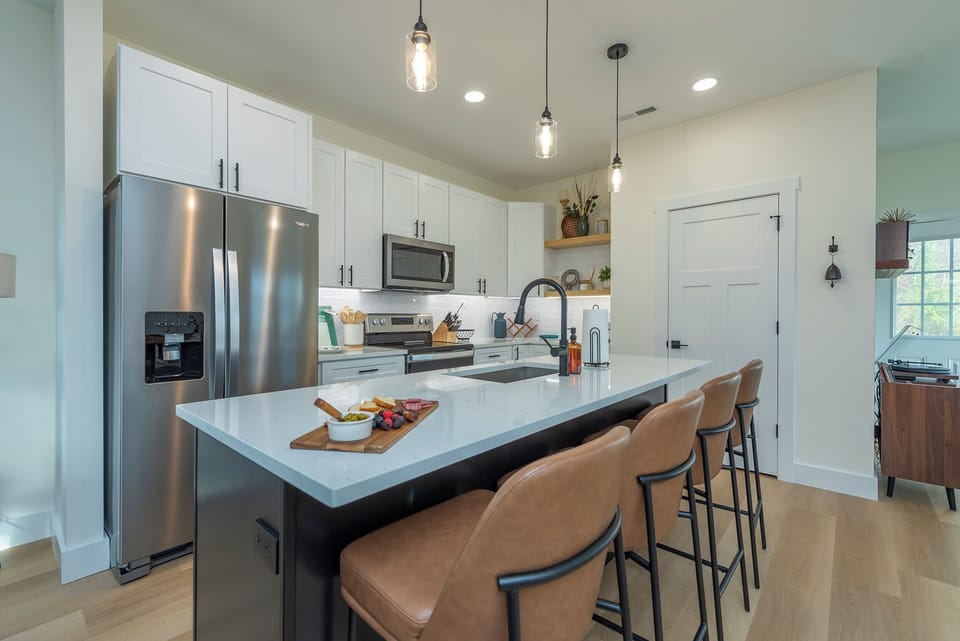 Kitchen with Giant Quartz Countertop - Large Pantry with Built-In Shelves