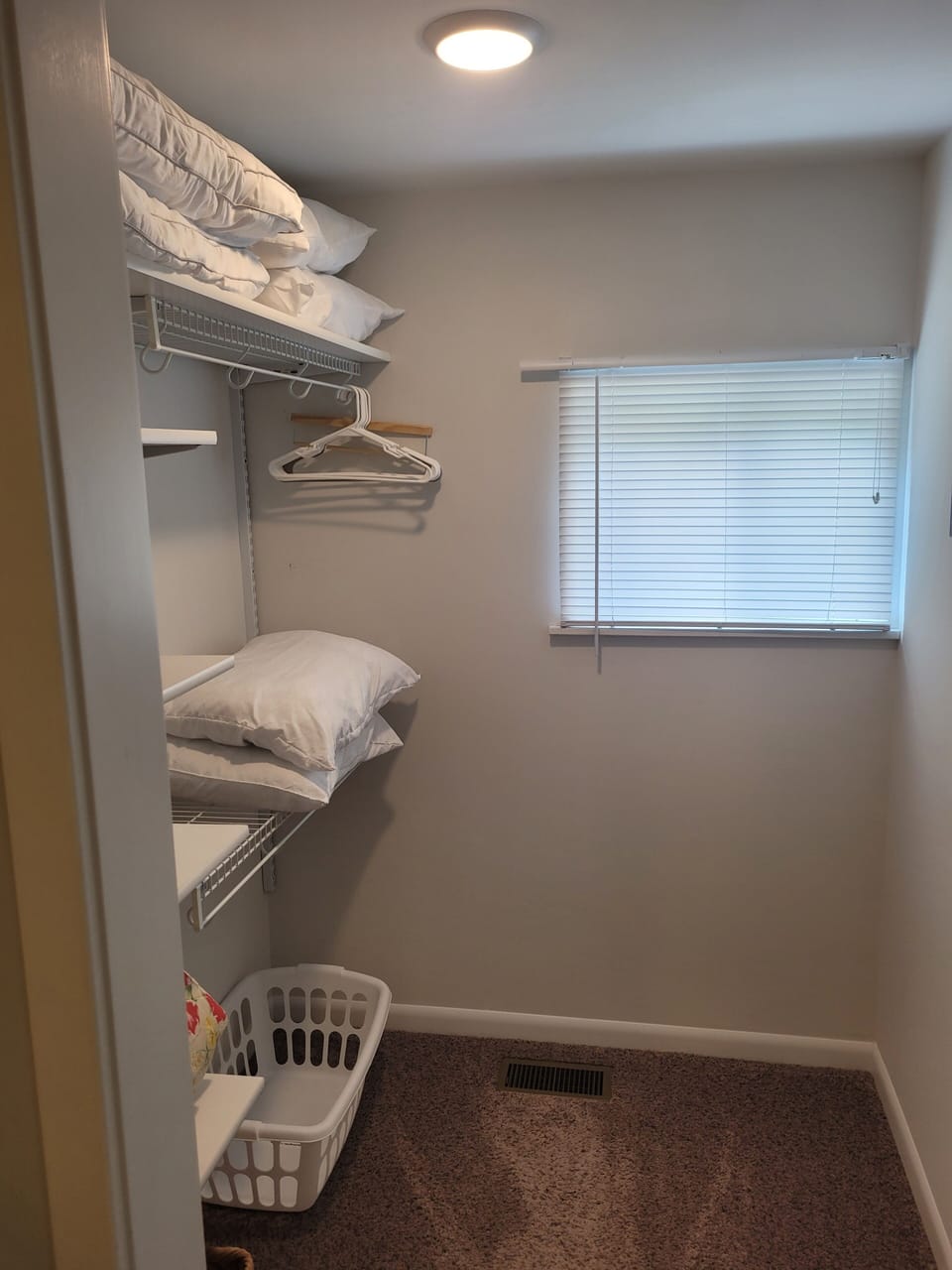 BEDROOM #1:   Master bedroom with a queen-size bed, walk-in closet, private en suite full bathroom, and streaming television.