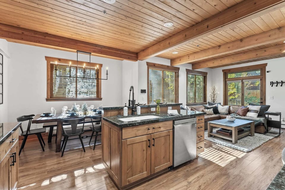 The chic, open kitchen offers ample space & all the comforts of home