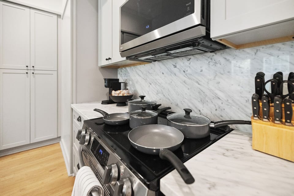 Cook Like a Chef! Our stove, paired with pots and pans, is ready for your culinary creations – perfect for cooking up a feast!
