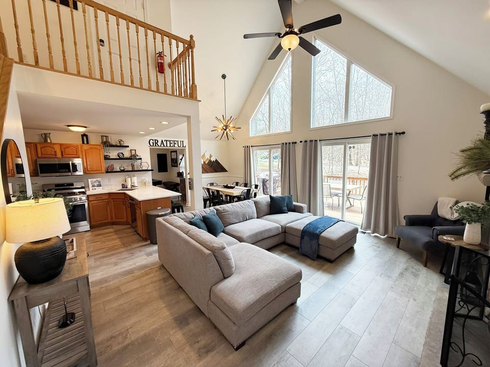 Cozy Cove’s natural lighting and modern chandelier create a welcoming atmosphere