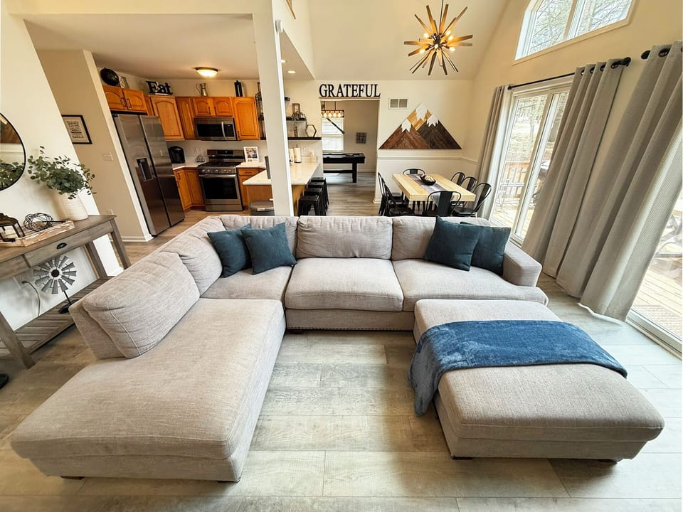 Cozy Cove features a large sectional in the open-concept area.